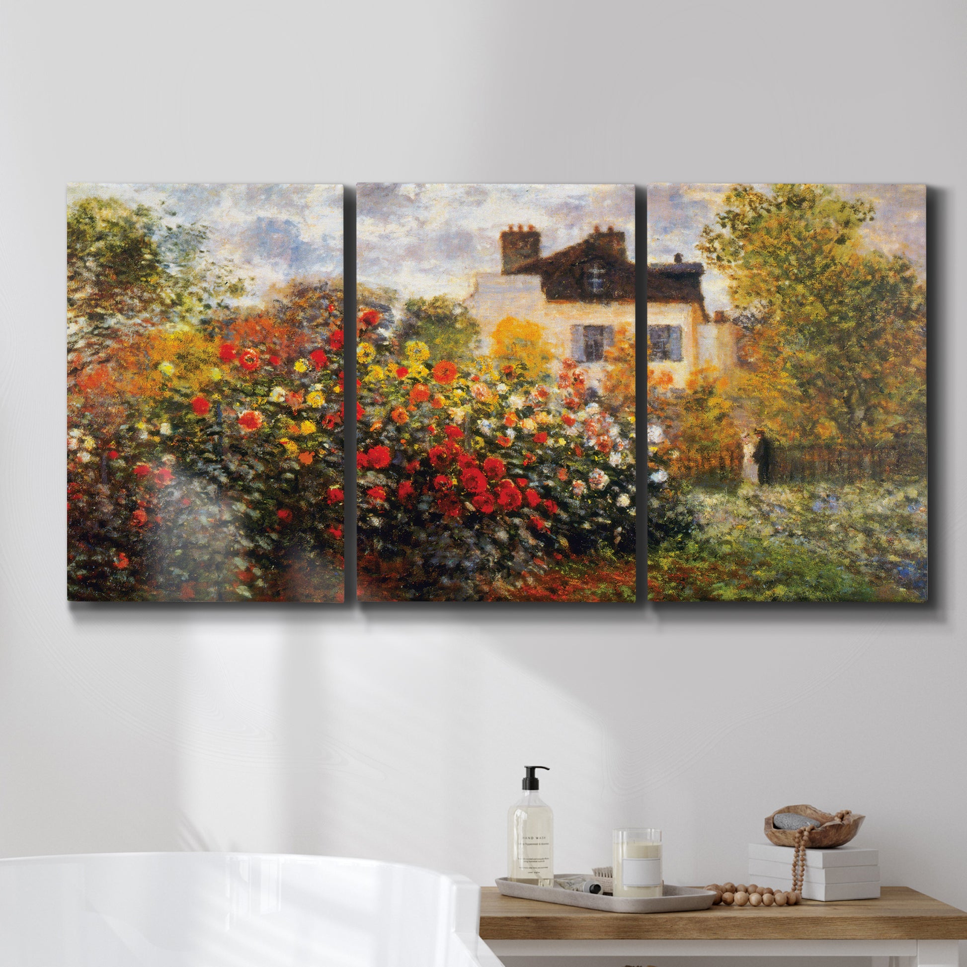 Three-panel canvas wall art featuring farm buildings in rural normandy, displayed in a bathroom above a bathtub.