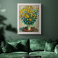 Impressionist floral painting of artichoke flowers by Claude Monet in an ornate weathered white frame displayed in a dark-toned interior setting.