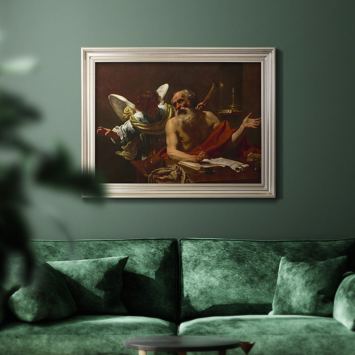 Classical religious painting of Saint Jerome with an angel by Simon Vouet in an ornate champagne frame displayed in a dark-toned interior setting.