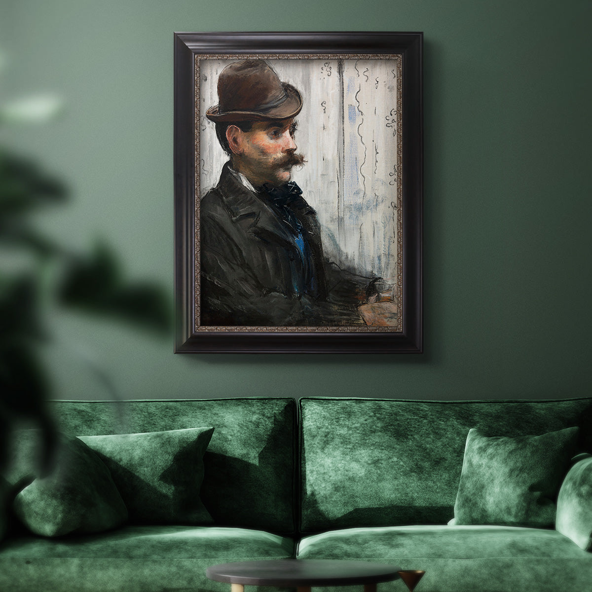Impressionist portrait of a seated man by Édouard Manet in an ornate black frame with gilded inner detail displayed in a dark-toned interior setting.