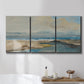 Three-panel canvas wall art featuring abstract coastal landscape, displayed in a bathroom above a bathtub.