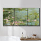 Three-panel canvas wall art featuring muted water lily pond, displayed in a bathroom above a bathtub.