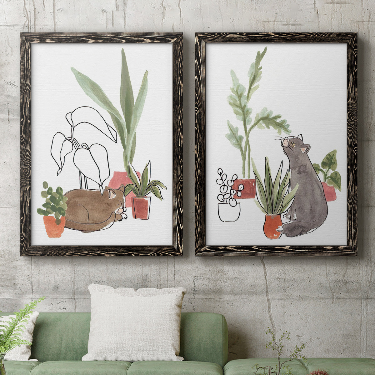 Set of two black barnwood framed canvas prints depicting a coordinated art pair of cats tucked among collections of potted houseplants rendered as whimsical botanical animal illustrations above a sofa in a modern living room.