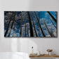 Three-panel canvas wall art featuring night landscape silhouette photography, displayed in a bathroom above a bathtub.