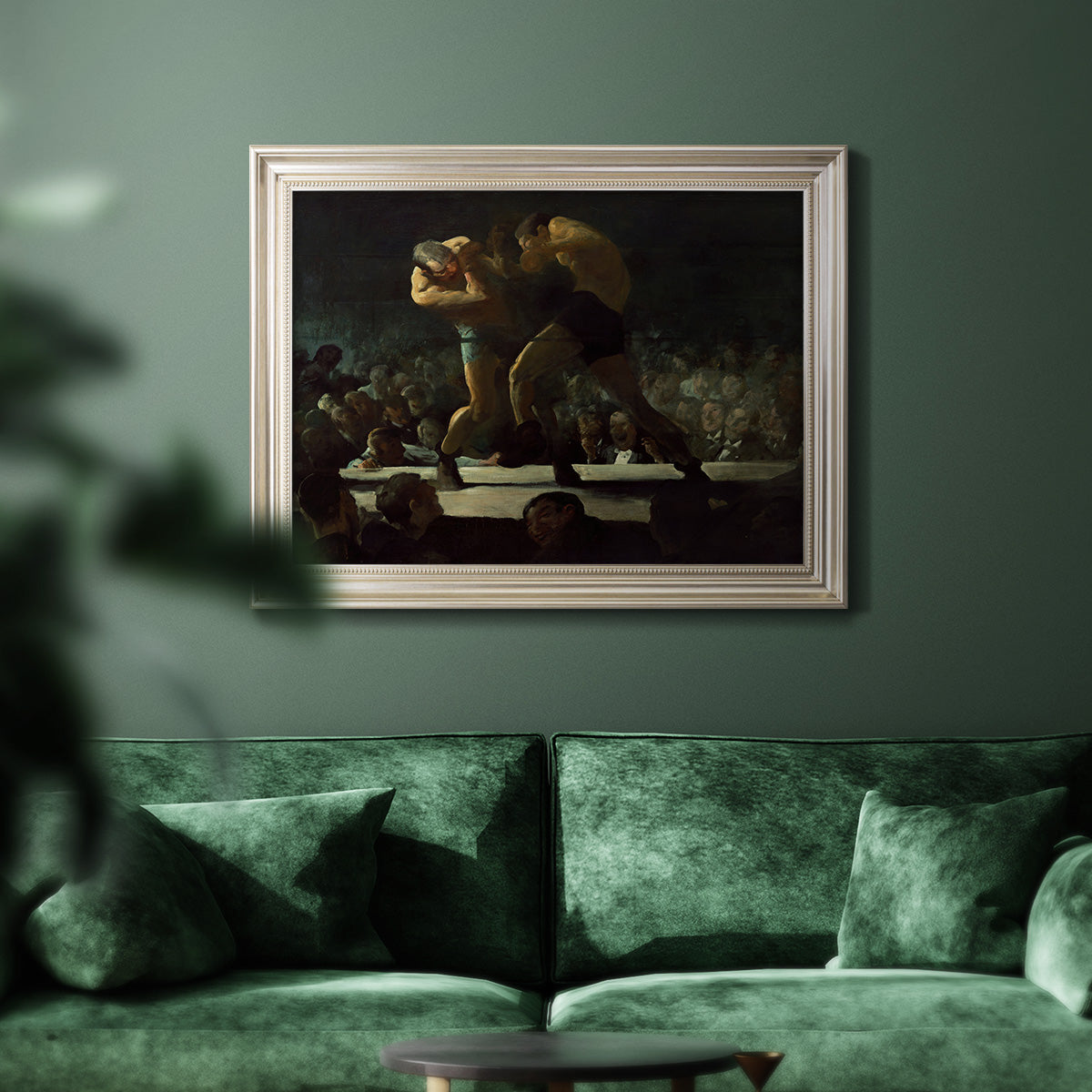 American social club scene painting by George Bellows in an ornate champagne frame displayed in a dark-toned interior setting.