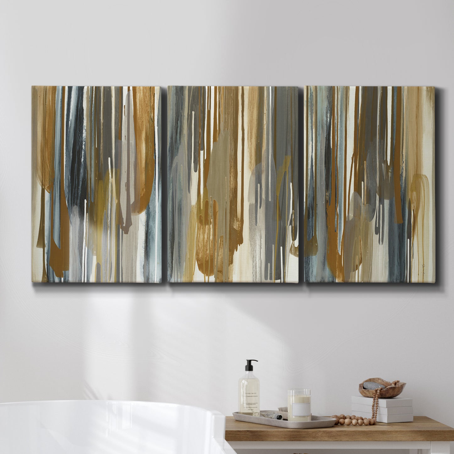 Three-panel canvas wall art featuring abstract vertical illusion pattern, displayed in a bathroom above a bathtub.