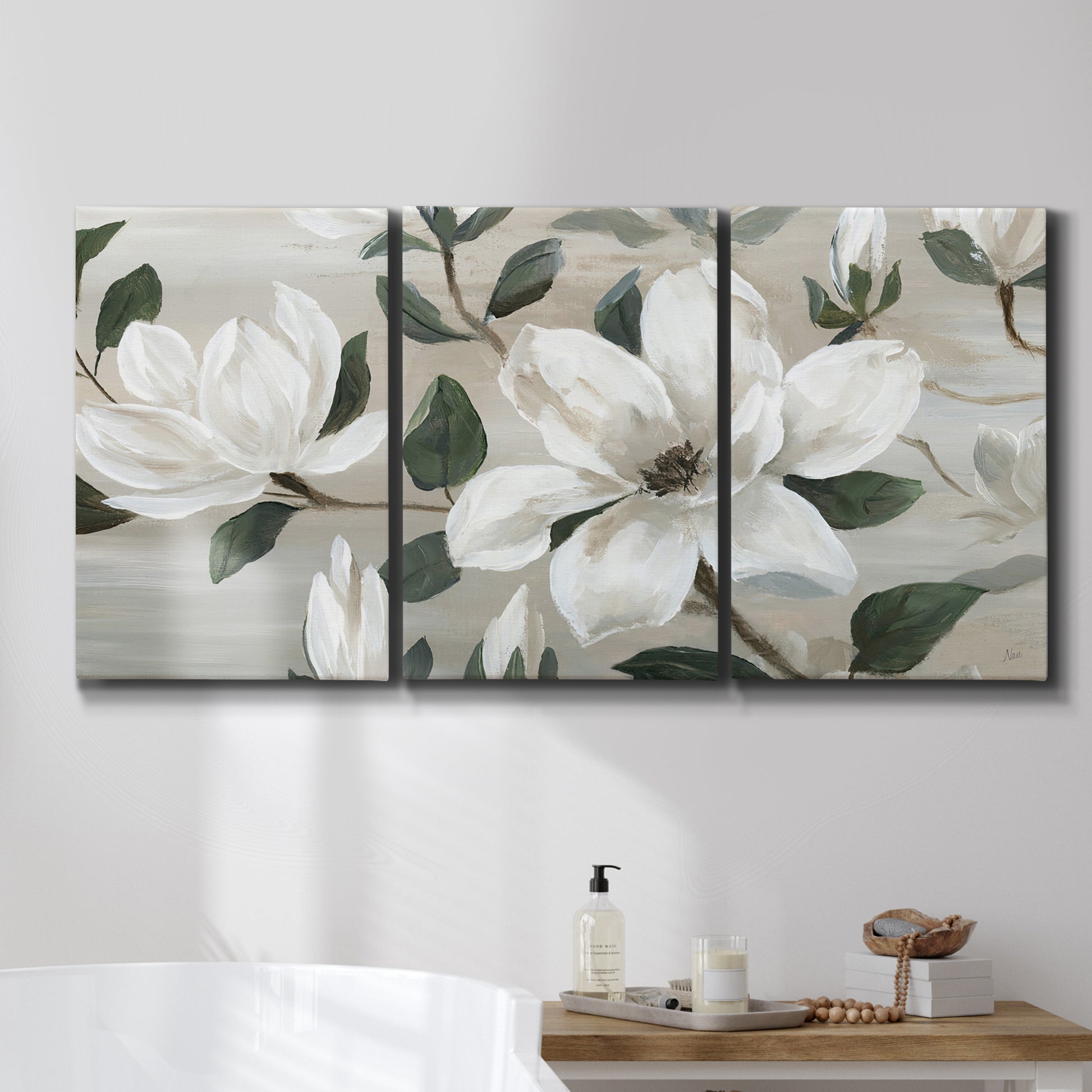 Three-panel canvas wall art featuring soft southern floral charm, displayed in a bathroom above a bathtub.