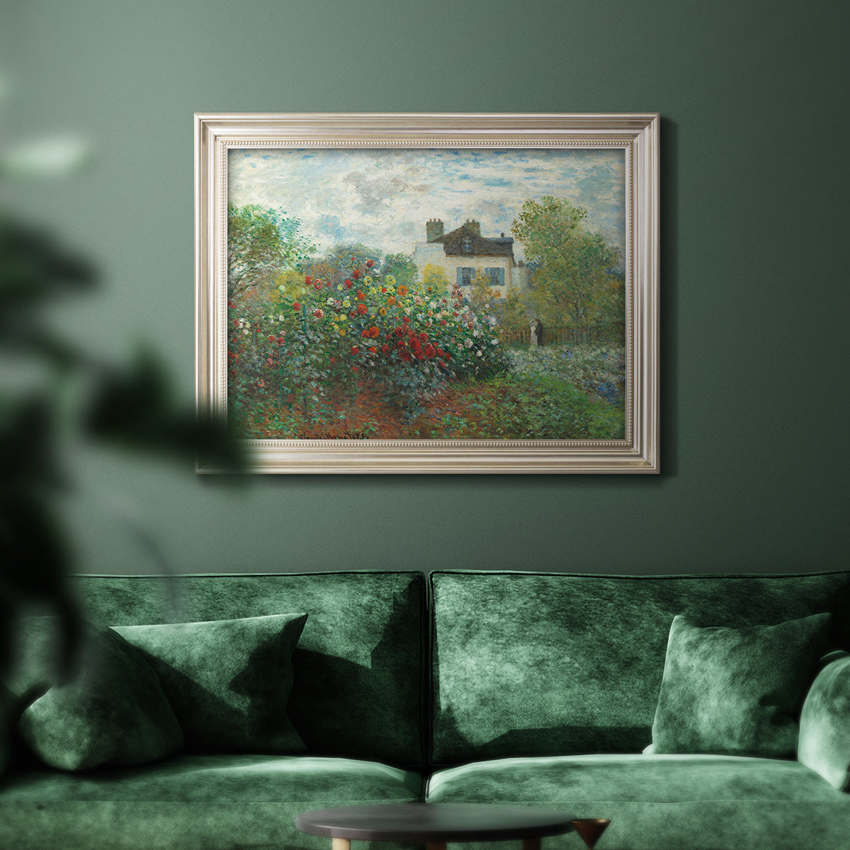 Impressionist garden landscape at Argenteuil by Claude Monet in an ornate champagne frame displayed in a dark-toned interior setting.