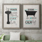 Set of two gray barnwood framed canvas prints depicting a coordinated art pair of playful bathtub silhouettes and bath-themed typography rendered as graphic bathroom word art above a sofa in a modern living room.