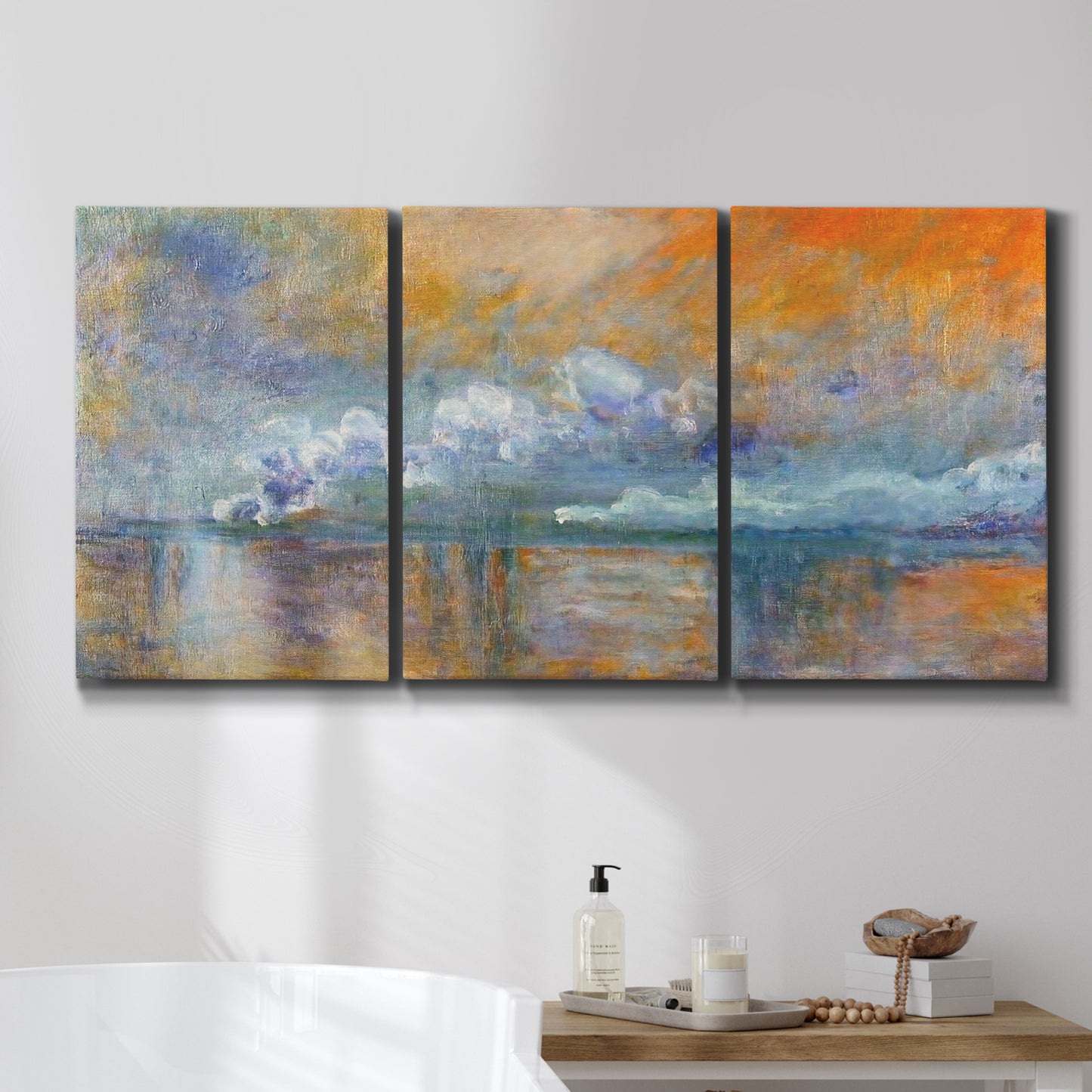 Three-panel canvas wall art featuring bridge shrouded in fog and smoke, displayed in a bathroom above a bathtub.
