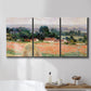 Three-panel canvas wall art featuring haystacks arranged in rural field, displayed in a bathroom above a bathtub.