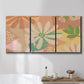 Three-panel canvas wall art featuring neutral toned botanical floral silhouettes, displayed in a bathroom above a bathtub.