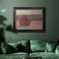 Impressionist haystack sunset scene in winter by Claude Monet in an ornate black frame with gilded inner detail displayed in a dark-toned interior setting.