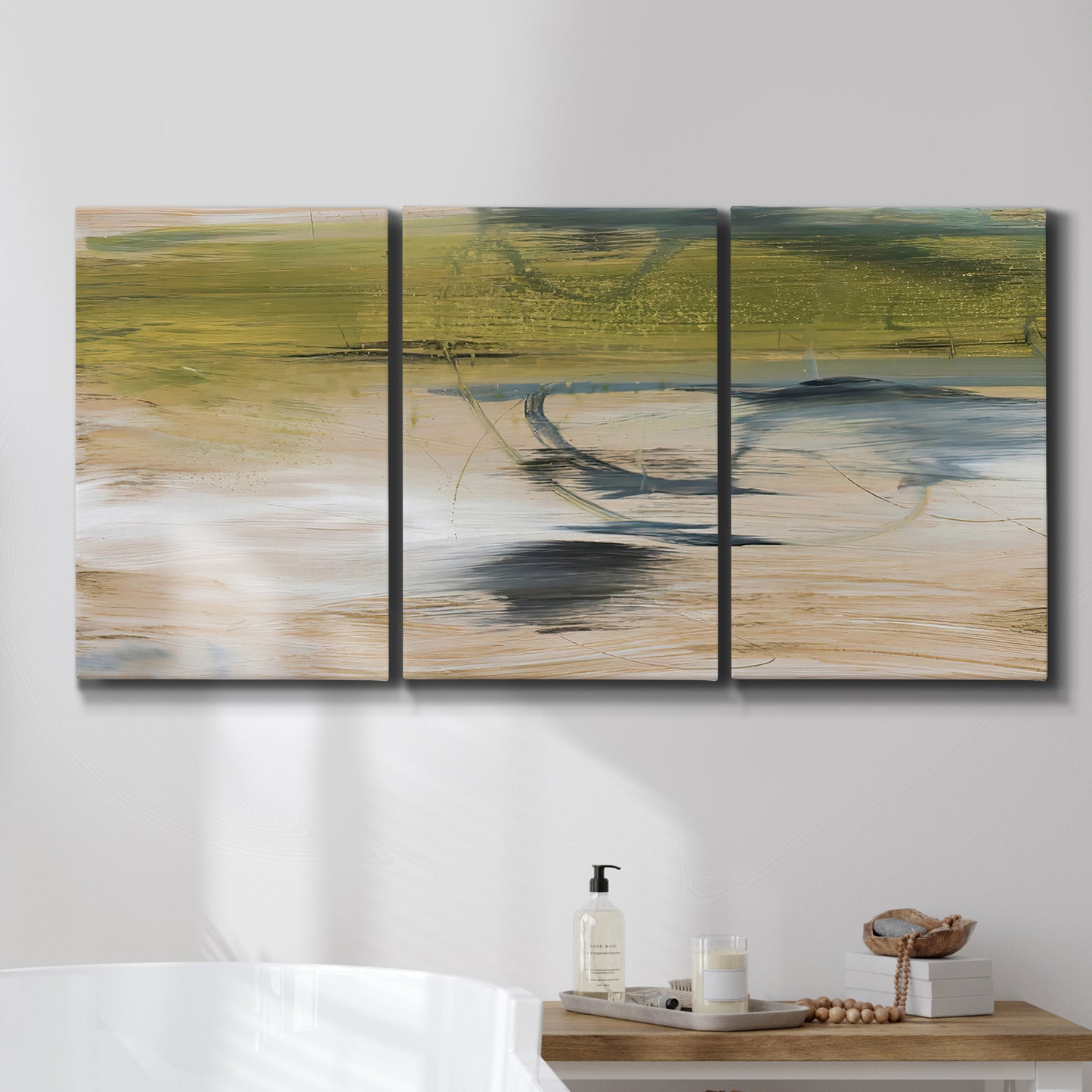 Three-panel canvas wall art featuring minimal abstract water reflections, displayed in a bathroom above a bathtub.