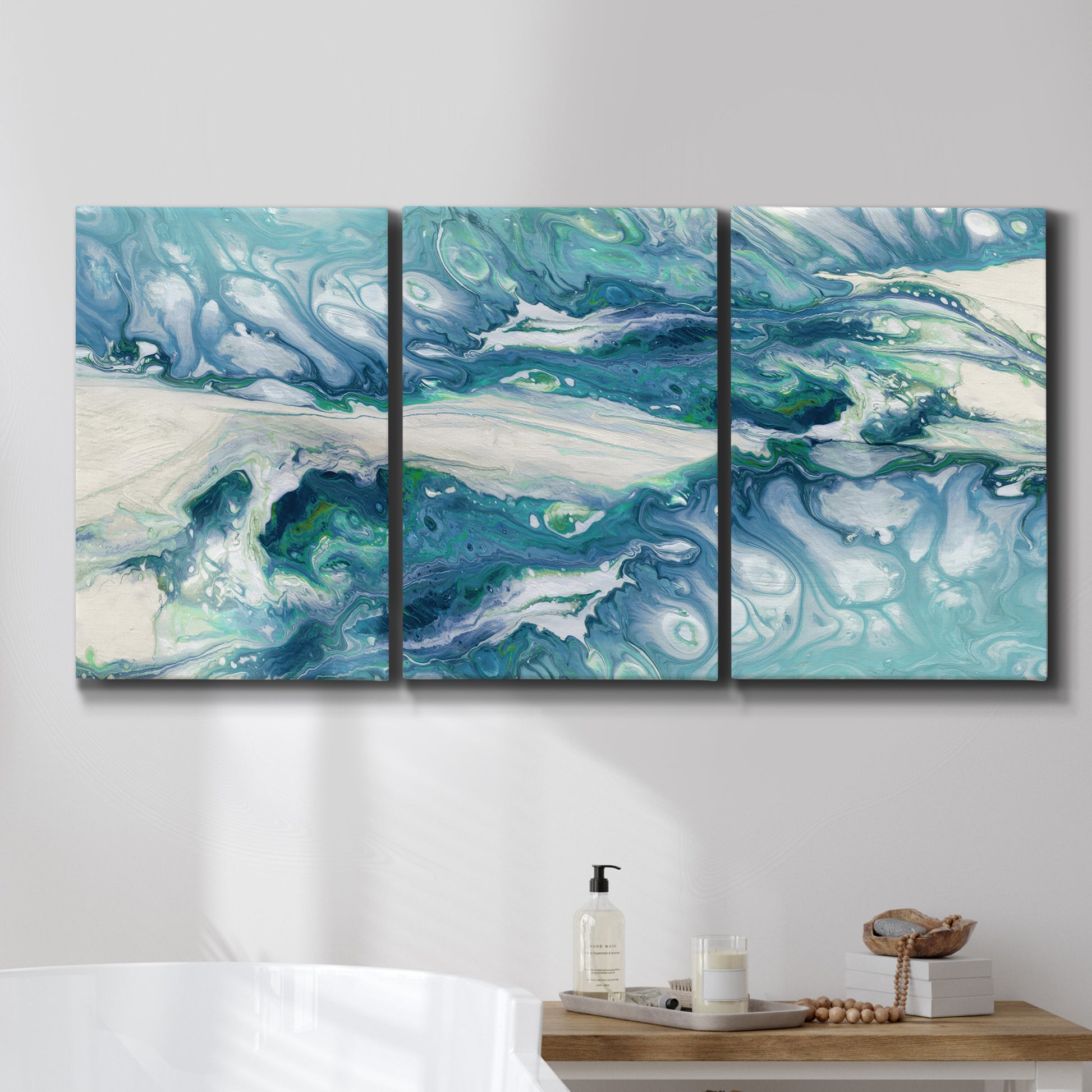 Three-panel canvas wall art featuring layered abstract marble textures, displayed in a bathroom above a bathtub.