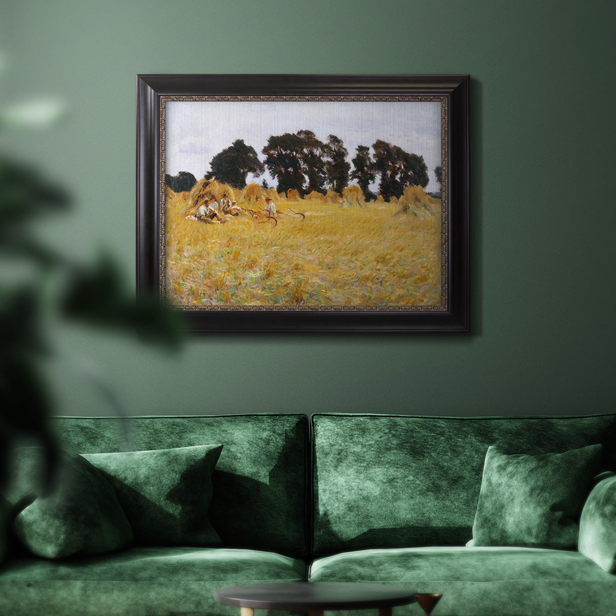 Impressionist rural harvest scene by John Singer Sargent in an ornate black frame with gilded inner detail displayed in a dark-toned interior setting.