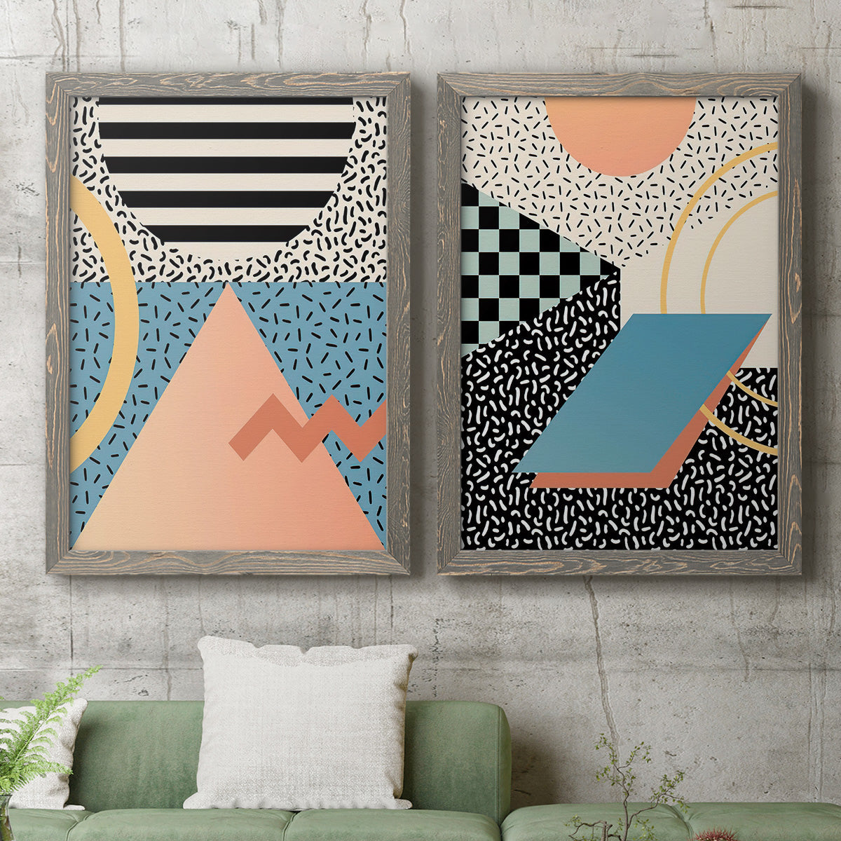 Set of two gray barnwood framed canvas prints depicting a coordinated art pair of bold geometric Memphis-style patterns rendered as retro graphic abstracts above a sofa in a modern living room.