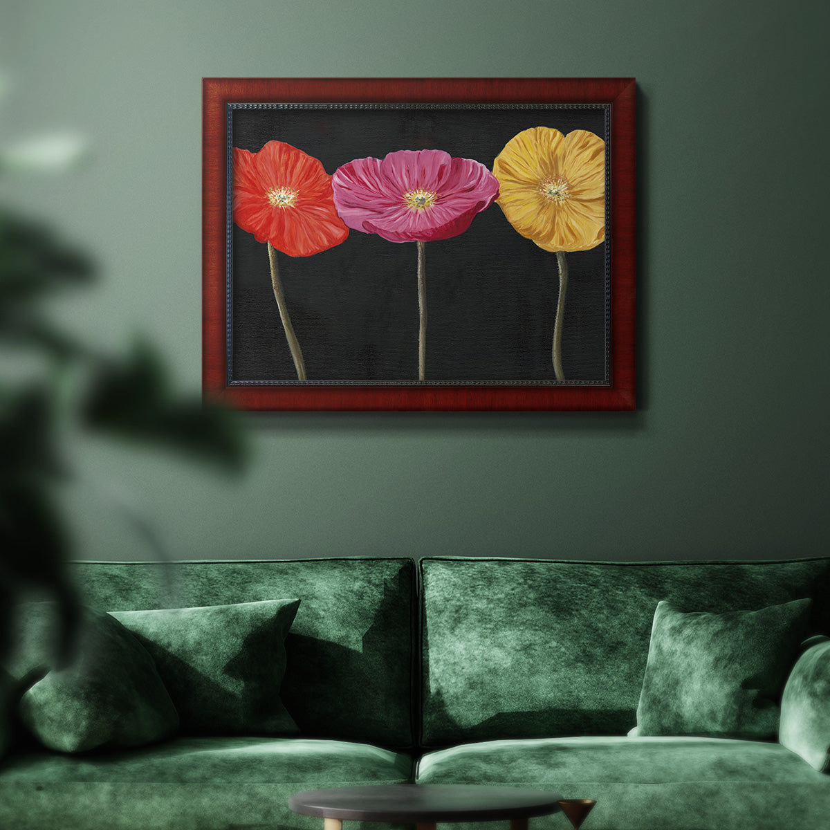 Contemporary poppy flower artwork in an ornate cherry burl wood frame displayed in a dark-toned interior setting.