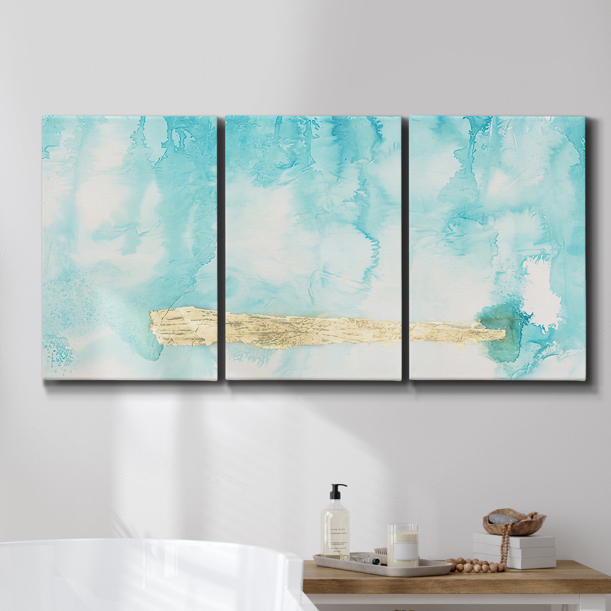 Three-panel canvas wall art featuring saturated abstract color fields, displayed in a bathroom above a bathtub.