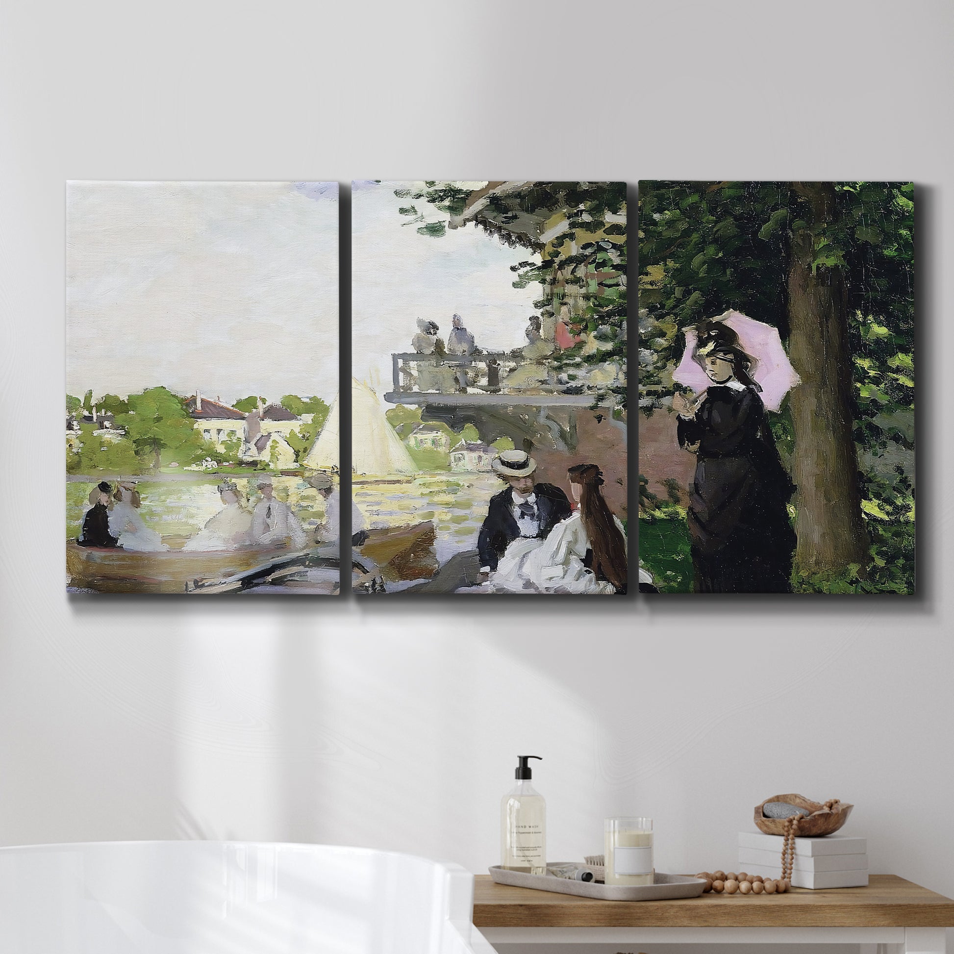 Three-panel canvas wall art featuring garden house beside river, displayed in a bathroom above a bathtub.
