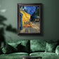 Impressionist night café street scene by Vincent van Gogh in an ornate black frame with gilded inner detail displayed in a dark-toned interior setting.