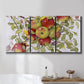 Three-panel canvas wall art featuring apples hanging from branch, displayed in a bathroom above a bathtub.