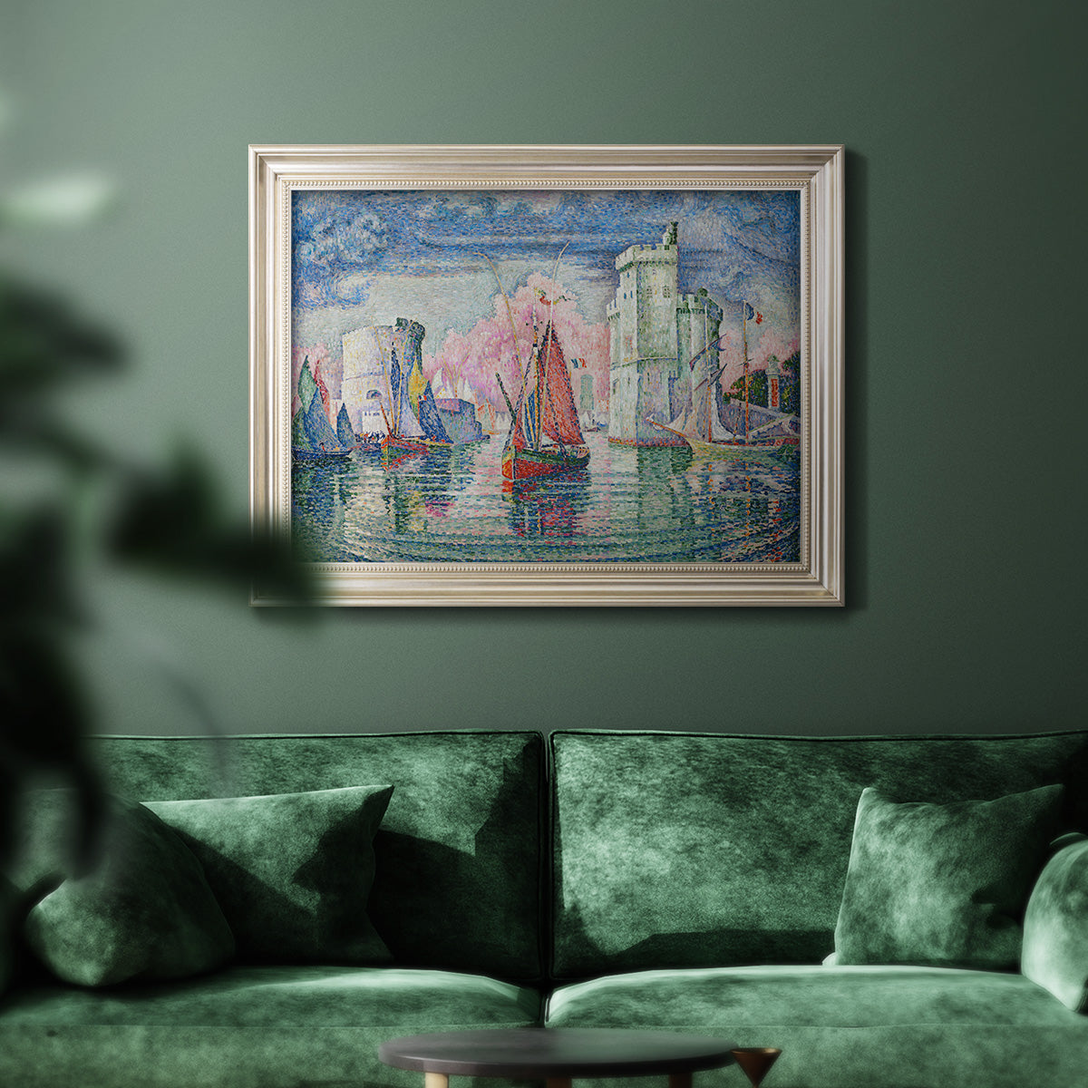Impressionist harbor scene by Paul Signac in an ornate champagne frame displayed in a dark-toned interior setting.
