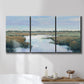 Three-panel canvas wall art featuring coastal plain with layered horizon, displayed in a bathroom above a bathtub.
