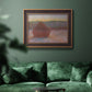 Impressionist haystack sunset scene in winter by Claude Monet in an ornate bronzed mahogany wood frame displayed in a dark-toned interior setting.