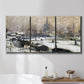 Three-panel canvas wall art featuring snowy village road in winter, displayed in a bathroom above a bathtub.