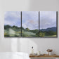 Three-panel canvas wall art featuring wide open pastoral horizon landscape, displayed in a bathroom above a bathtub.