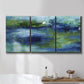 Three-panel canvas wall art featuring flowing blue abstract watercolor, displayed in a bathroom above a bathtub.