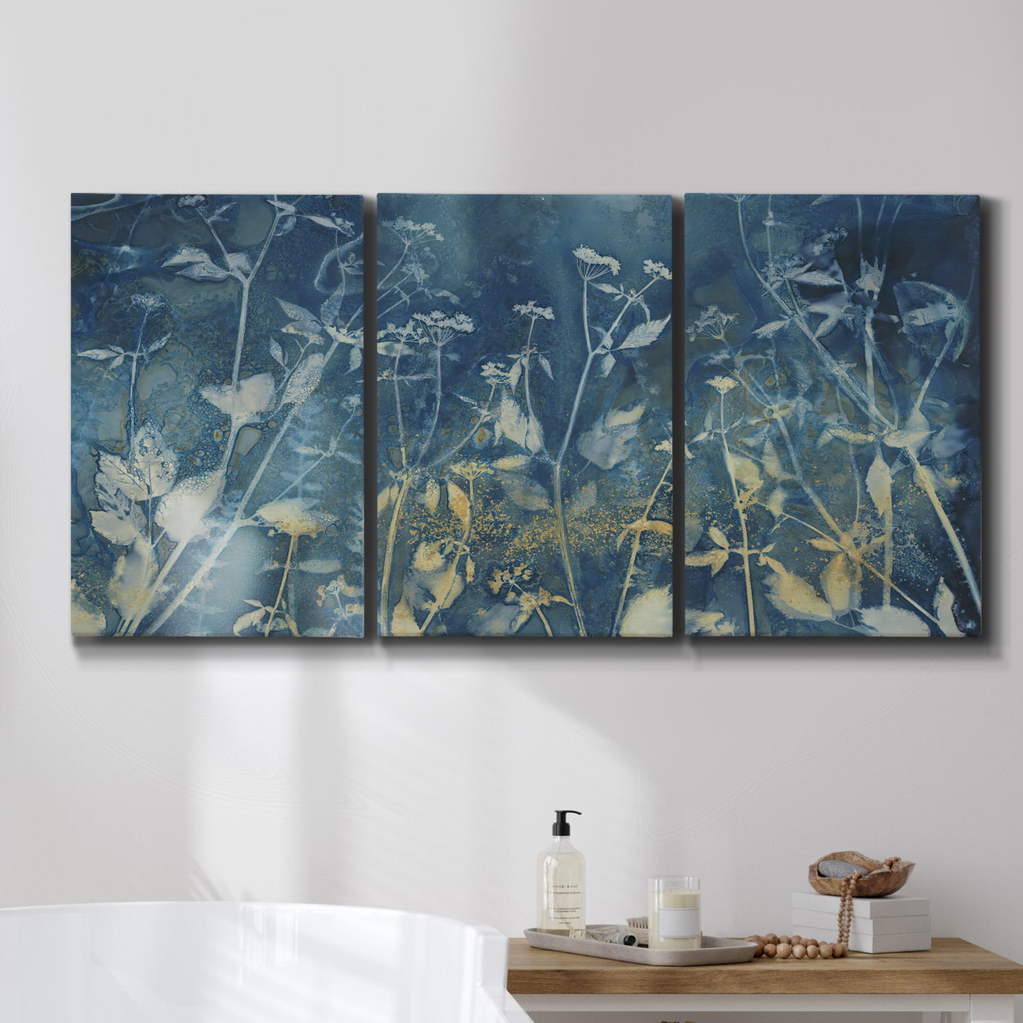 Three-panel canvas wall art featuring dark abstract with rich tonal depth, displayed in a bathroom above a bathtub.