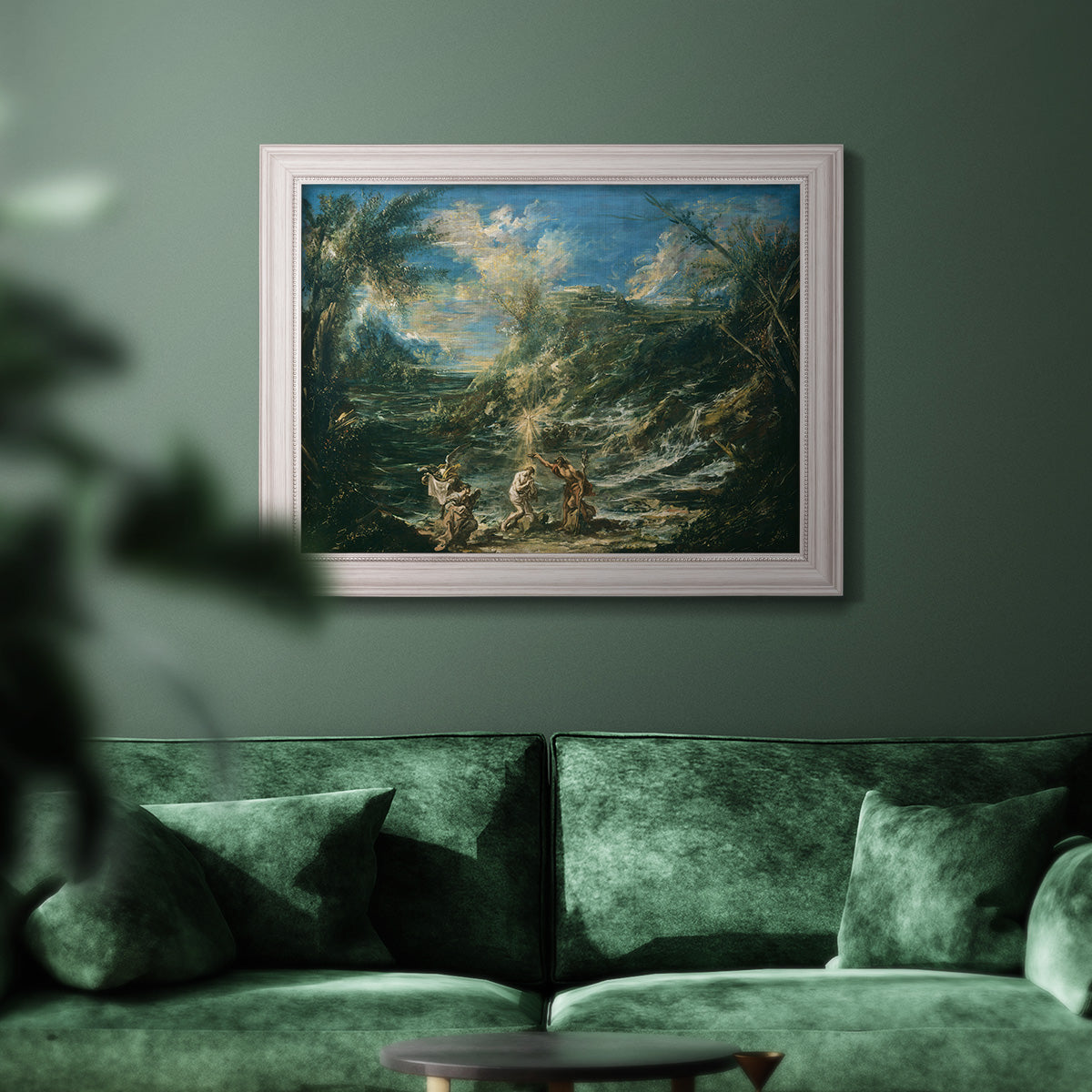 Religious landscape depicting the baptism of Christ by Alessandro Magnasco in an ornate weathered white frame displayed in a dark-toned interior setting.