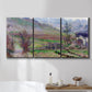 Three-panel canvas wall art featuring cliffside cottage overlooking sea, displayed in a bathroom above a bathtub.