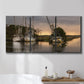 Three-panel canvas wall art featuring fishing trawlers on working harbor, displayed in a bathroom above a bathtub.