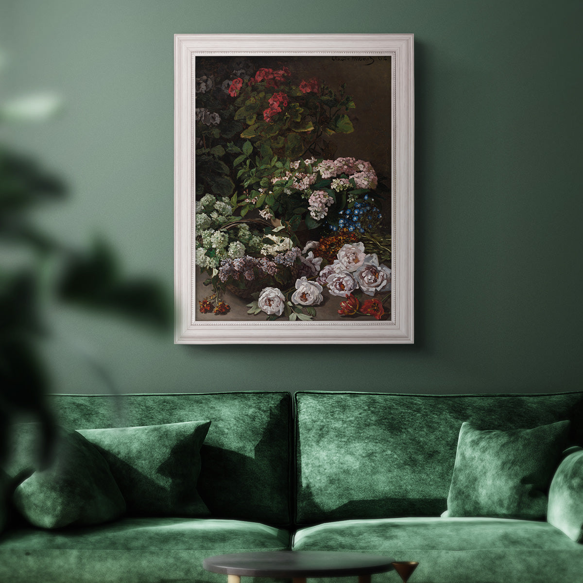 Early impressionist floral painting by Claude Monet in an ornate weathered white frame displayed in a dark-toned interior setting.