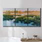 Three-panel canvas wall art featuring pastoral marshland landscape, displayed in a bathroom above a bathtub.