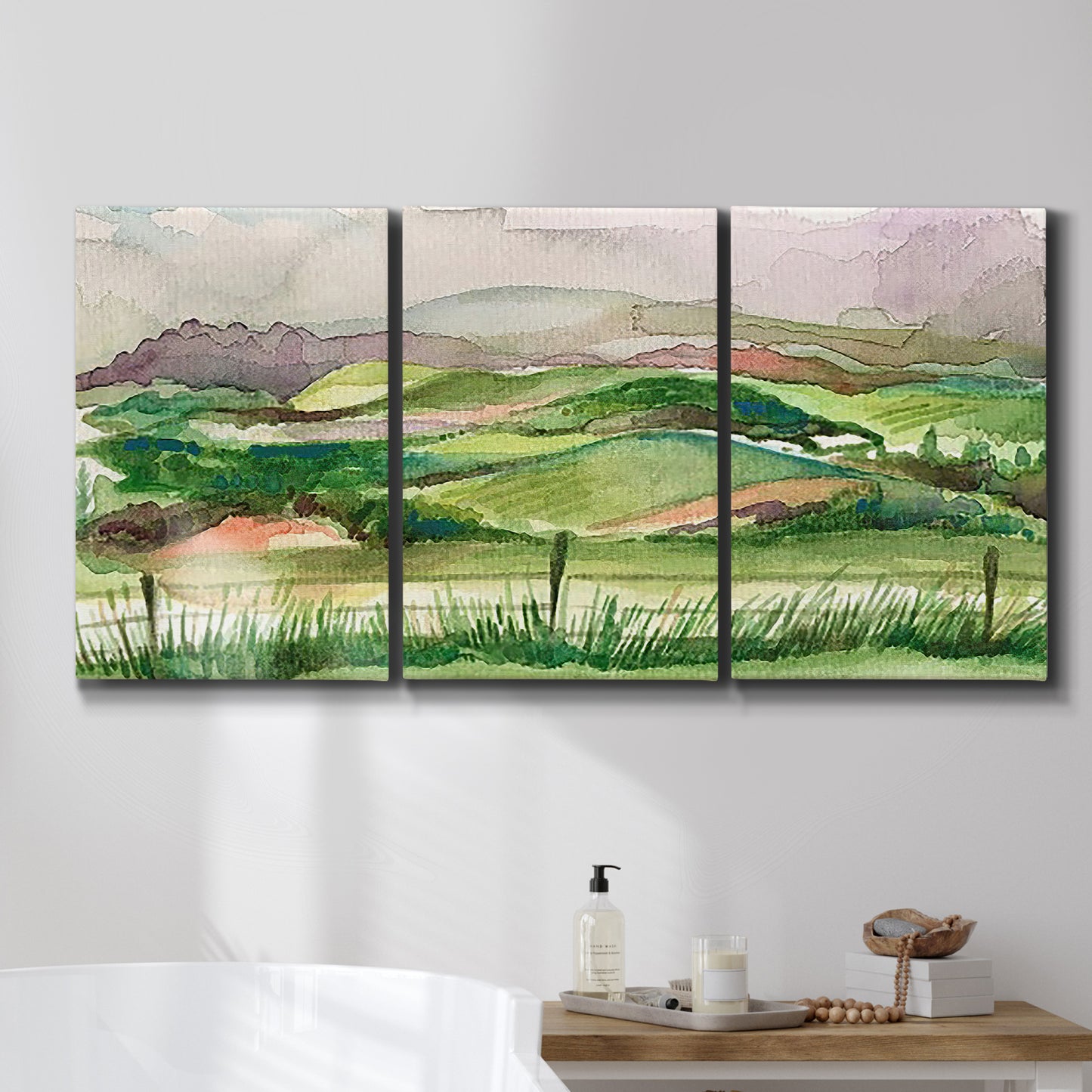 Three-panel canvas wall art featuring rainy landscape with soft atmosphere, displayed in a bathroom above a bathtub.