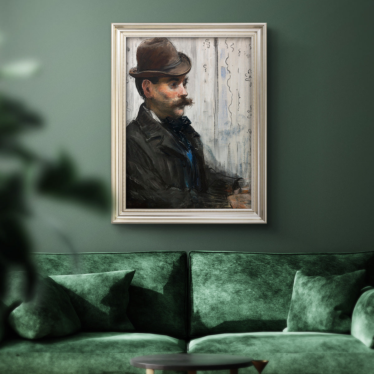 Impressionist portrait of a seated man by Édouard Manet in an ornate champagne frame displayed in a dark-toned interior setting.