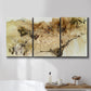 Three-panel canvas wall art featuring muted abstract with metallic gold accents, displayed in a bathroom above a bathtub.