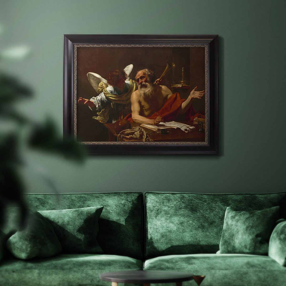 Classical religious painting of Saint Jerome with an angel by Simon Vouet in an ornate black frame with gilded inner detail displayed in a dark-toned interior setting.
