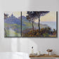 Three-panel canvas wall art featuring village church at sunset, displayed in a bathroom above a bathtub.