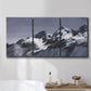 Three-panel canvas wall art featuring moonlit mountain peaks under night sky, displayed in a bathroom above a bathtub.