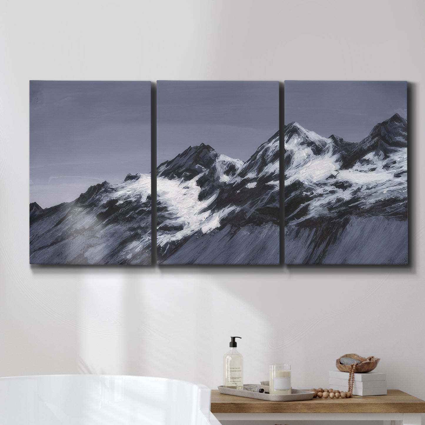 Three-panel canvas wall art featuring moonlit mountain peaks under night sky, displayed in a bathroom above a bathtub.