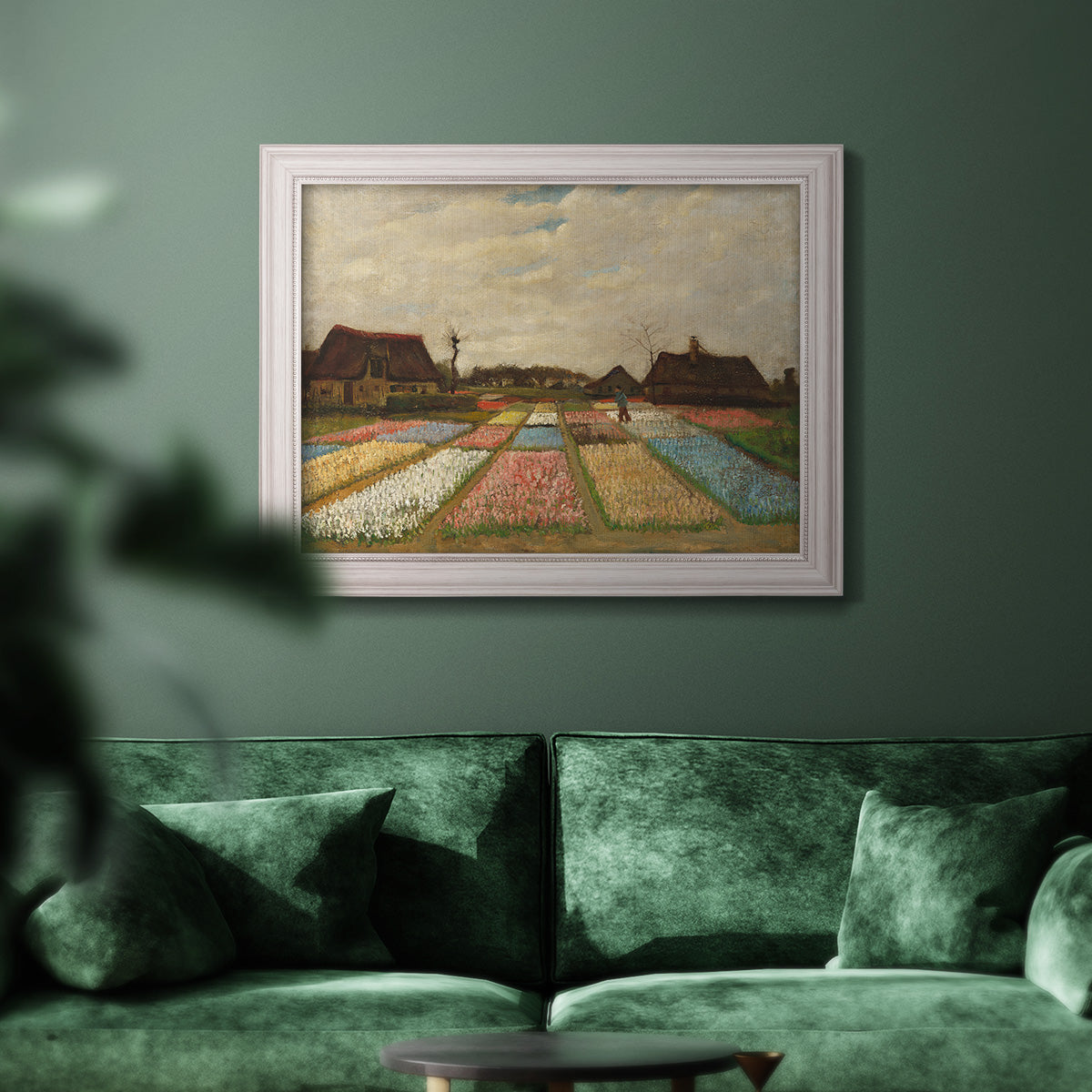 Impressionist Dutch bulb field landscape by Vincent van Gogh in an ornate weathered white frame displayed in a dark-toned interior setting.