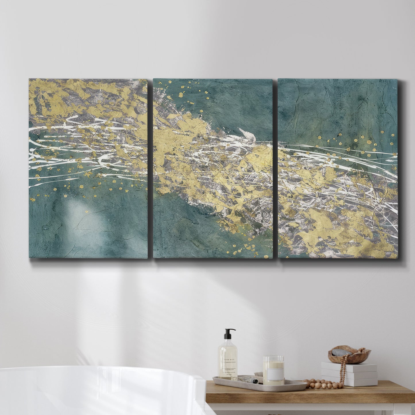 Three-panel canvas wall art featuring soft abstract wind movement, displayed in a bathroom above a bathtub.