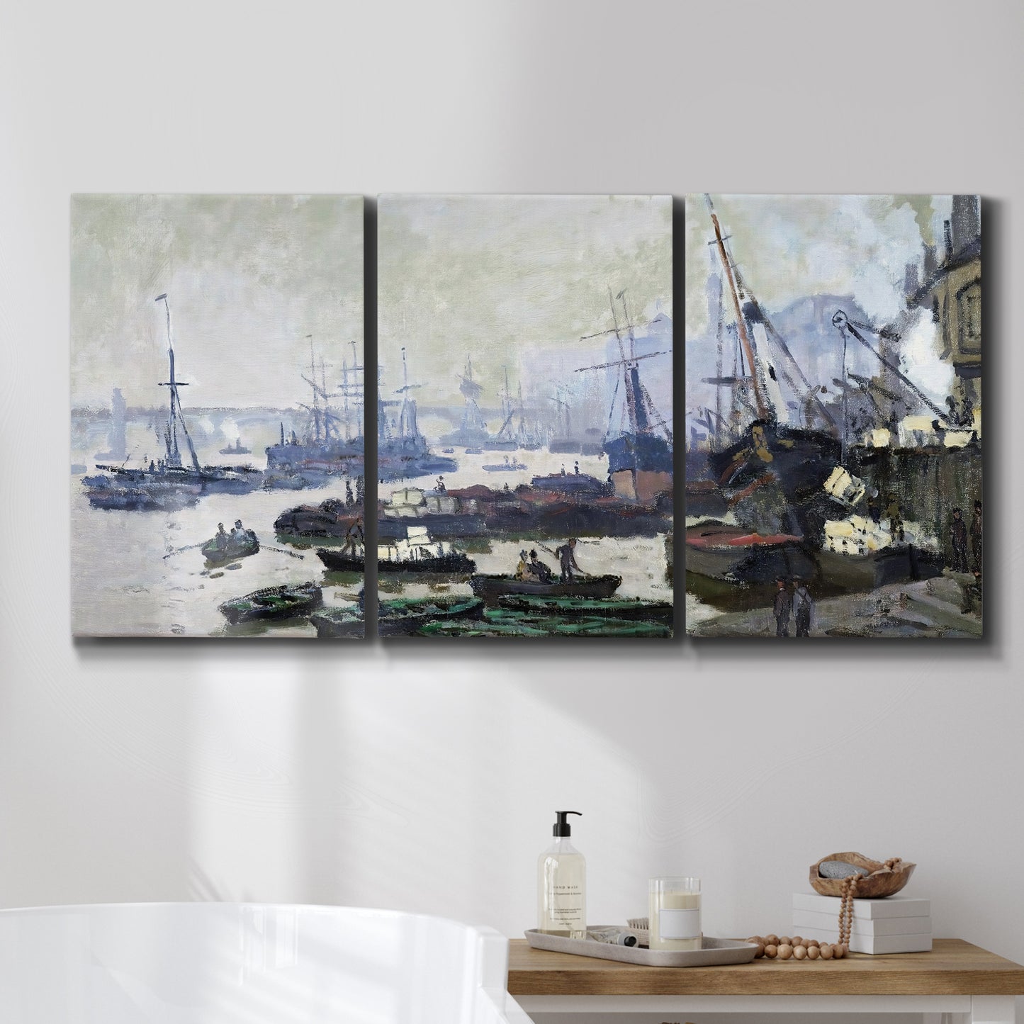 Three-panel canvas wall art featuring working harbor with docked boats, displayed in a bathroom above a bathtub.
