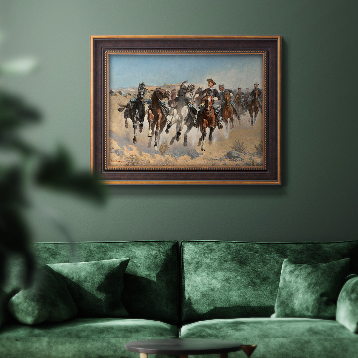 Impressionist western action scene by Frederic Remington in an ornate bronzed mahogany wood frame displayed in a dark-toned interior setting.