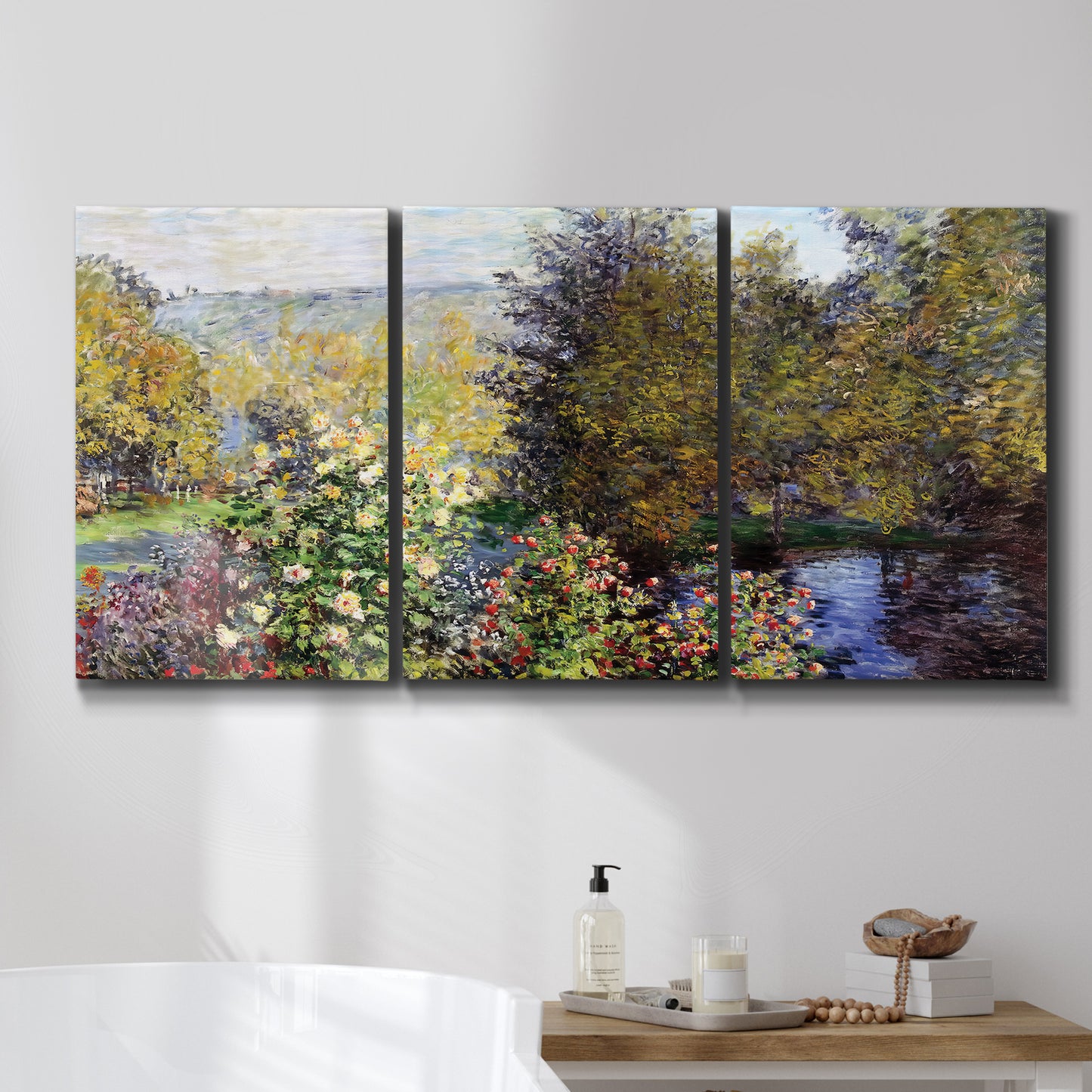 Three-panel canvas wall art featuring garden corner with flowering trees, displayed in a bathroom above a bathtub.